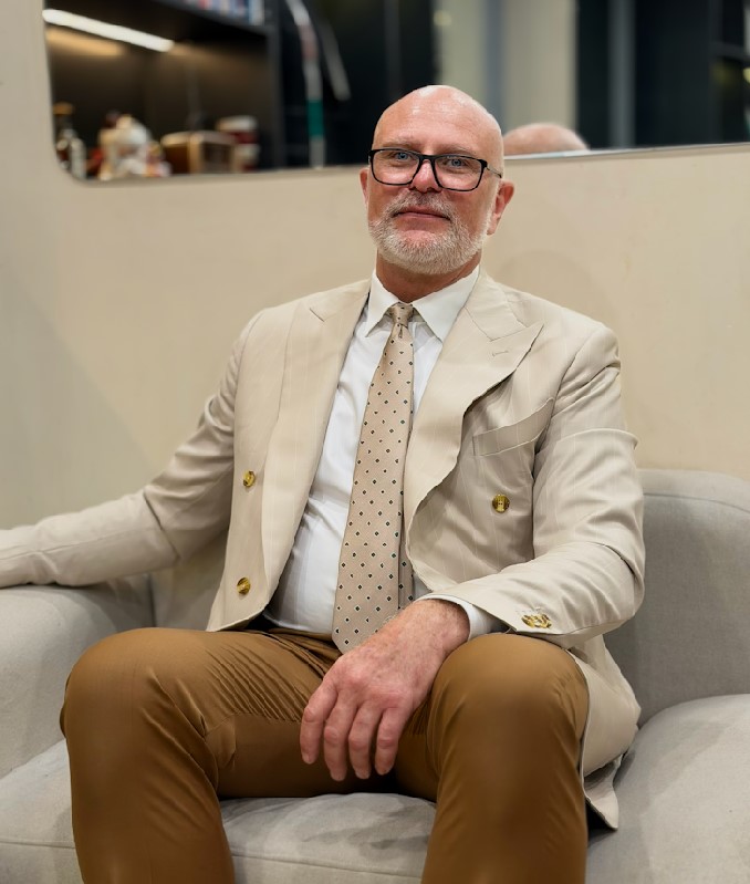 A dark beige, pinstriped suit featuring custom made buttons, tailored by Unlim Tailor in Hanoi - detail images